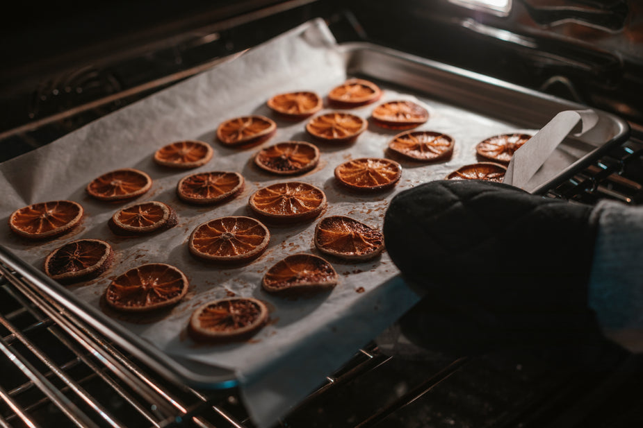 ambidextrous oven glove putting tray into oven