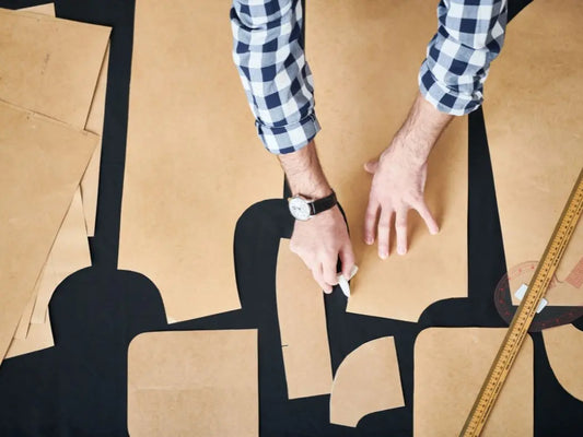 patterns on fabric and chalk being used to mark pattern. 