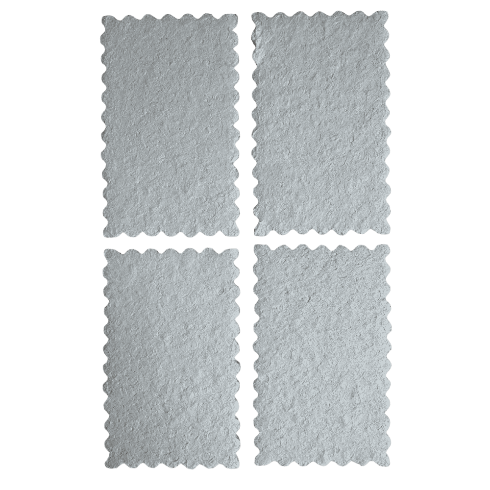 Eco-friendly kitchen sponges displayed in a grid showing their textured surface and scalloped edges.